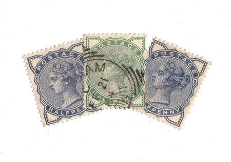 Vintage Queen Victoria postage stamps from Great Britain isolated on a white background.の写真素材