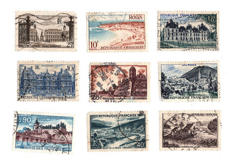 A collection of vintage postage stamps from France isolated on a white background.の写真素材
