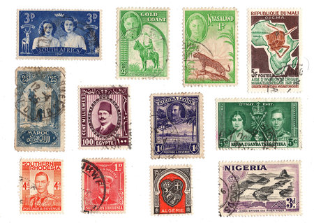 A collection of vintage postage stamps from Africa isolated on a white background.の写真素材