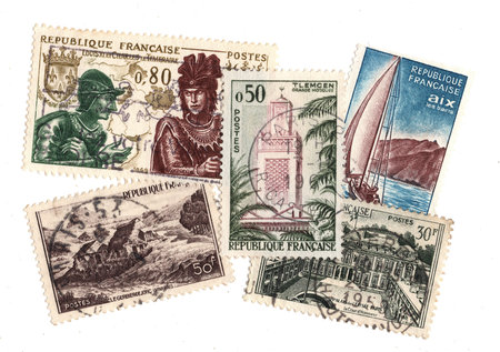 A collection of vintage postage stamps from France isolated on a white background.の写真素材