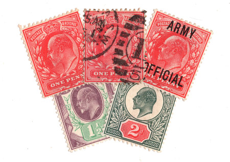 Vintage King Edward VII postage stamps from Great Britain isolated on a white background.