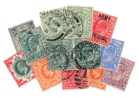 Vintage King Edward VII postage stamps from Great Britain isolated on a white background.