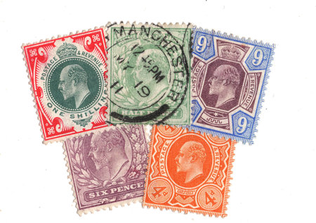 Vintage King George V postage stamps from Great Britain isolated on a white background.