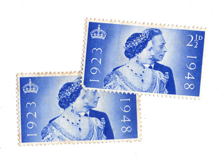 Vintage King George VI postage stamps from Great Britain isolated on a white background.