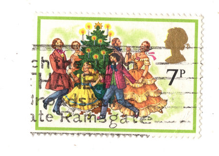 A vintage Christmas postage stamp from Great Britain isolated on a white background.の写真素材