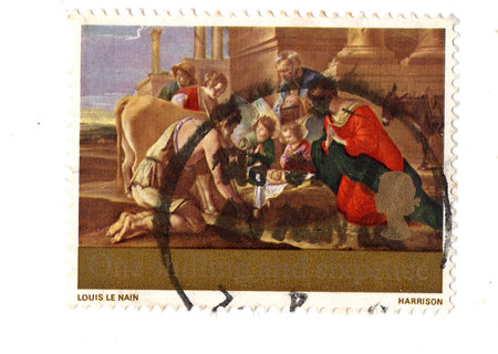 A vintage Christmas postage stamp from Great Britain isolated on a white background.