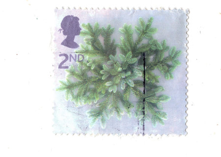 A vintage postage stamp from Great Britain isolated on a white background.の写真素材