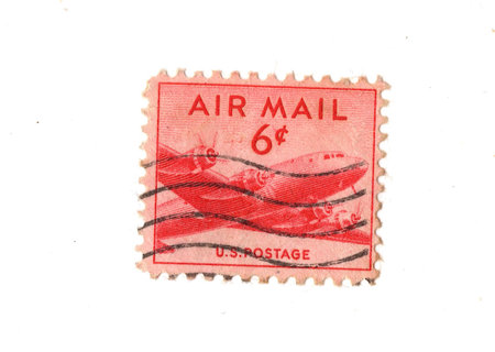 A vintage Air Mail postage stamp from the USA isolated on a white background.