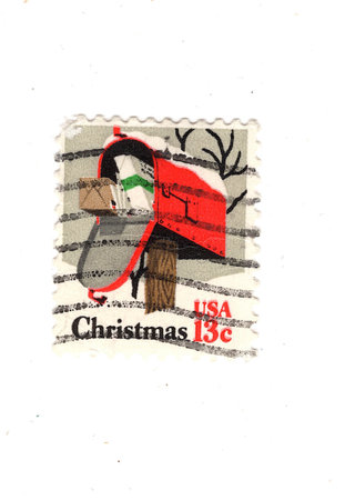 A vintage Christmas postage stamp from the USA isolated on a white background.の写真素材