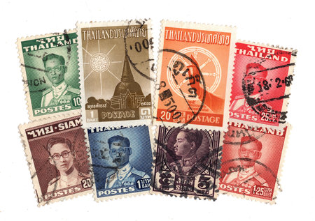 Vintage postage stamps from Thailand isolated on a white background.