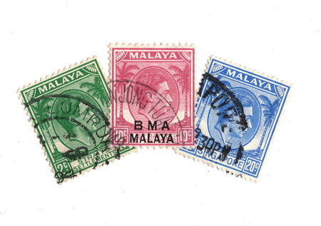 Vintage postage stamps from Malaya isolated on a white background.
