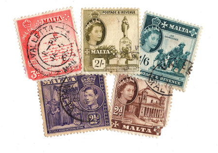 Vintage postage stamps from Malta isolated on a white background.