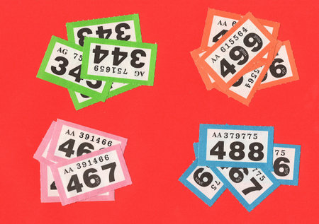 Vintage raffle tickets on a bright red background.の写真素材