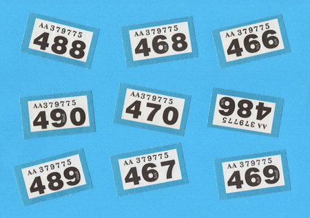 Vintage raffle tickets on a bright blue background.の写真素材