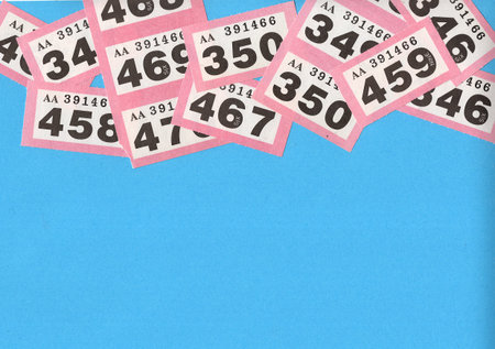 Vintage raffle tickets on a bright blue background.の写真素材