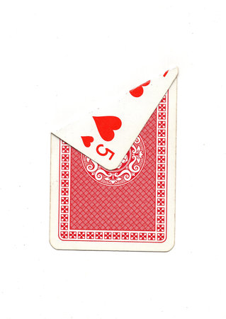 A vintage playing card on a white background with one corner revealed.