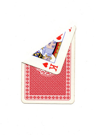 A vintage playing card on a white background with one corner revealed.