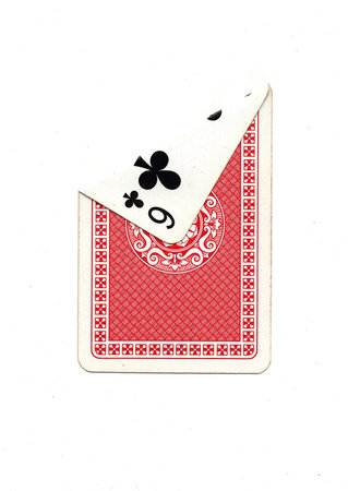 A vintage playing card on a white background with one corner revealed.