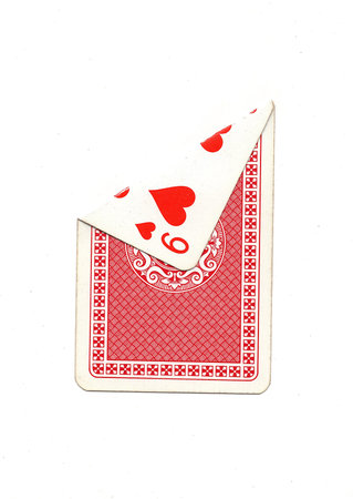A vintage playing card on a white background with one corner revealed.