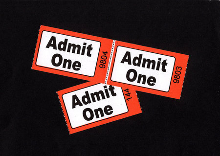 Admission tickets on a black background.