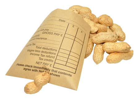 A brown paper wage packet containing peanuts, isolated on a white background 