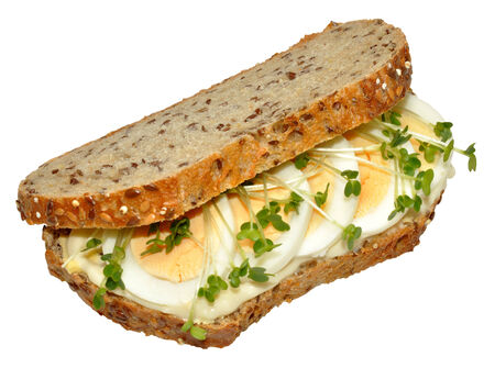 An egg and cress sandwich on wholegrain bread, isolated on a white の写真素材
