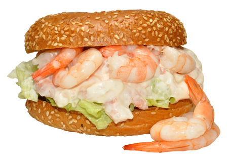 A prawn and mayonnaise filled sesame seed bagel, isolated on a white background の写真素材