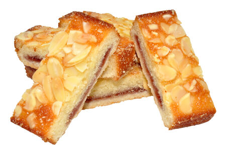 Almond cake slices with raspberry jam, isolated on a white background の写真素材