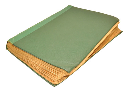 An old scruffy green hardback book isolated on a white backgroundの写真素材