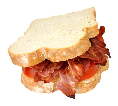 Grilled bacon and tomato sandwich on white sliced bread isolated on a white backgroundの写真素材