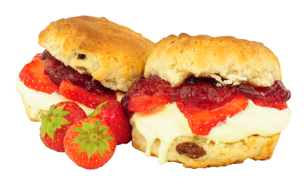 Fresh Strawberry and clotted cream scones with strawberry jam isolated on a white backgroundの写真素材