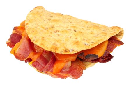 Cheese and bacon flatbread sandwich isolated on a white backgroundの写真素材