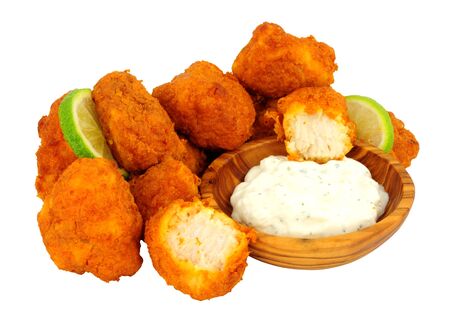 Chicken pakoras with raita dip in a wooden bowl isolated on a white backgroundの写真素材