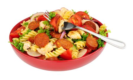 Chorizo and chicken pasta salad bowl isolated on a white backgroundの写真素材