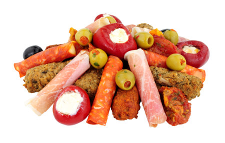 Group of savoury appetizer snacks including stuffed olives, lamb and chicken koftas and rollitos isolated on a white backgroundの写真素材