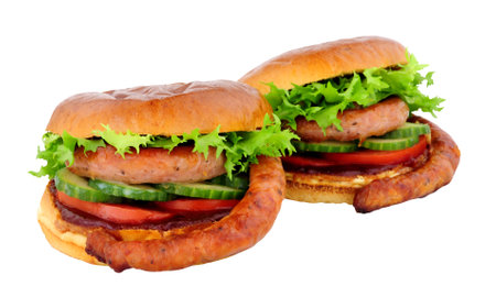 Cumberland sausage and salad sandwiches with barbecue sauce in a brioche bread rolls isolated on a white backgroundの写真素材