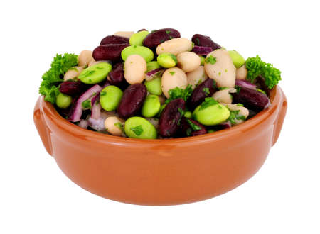 Bowl of fresh three bean salad isolated on a white background