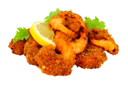 Spicy breadcrumb coated king prawns isolated on a white background