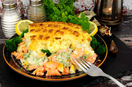 Mashed potato topped baked fisherman pie a traditional British mealの写真素材