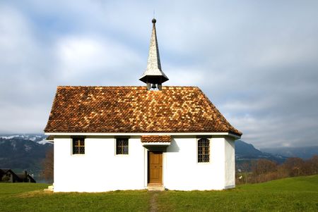 A small church in farmland in the Swiss countrysideの写真素材