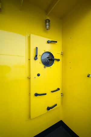 A water-tight door on a fire-fighting tug boatの写真素材
