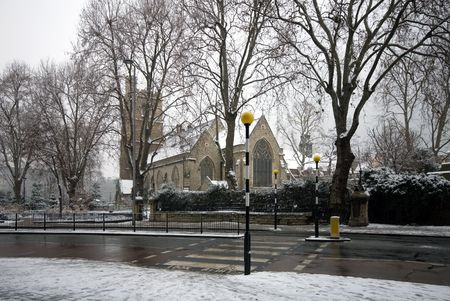 St Marys church, and the adjacent Lambeth Palace Road, London, England, on a cold, snowy, Winter's day.の写真素材