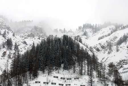 An alpine scene, complete with avalanche barriers, Italyの写真素材