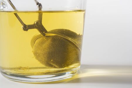 Clear glass cup of Chamomile isolated on a white backgroundのeditorial素材