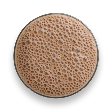 Glass of Chocolate Milkshake with frothy bubbles, shot from above with drop dhadowの写真素材