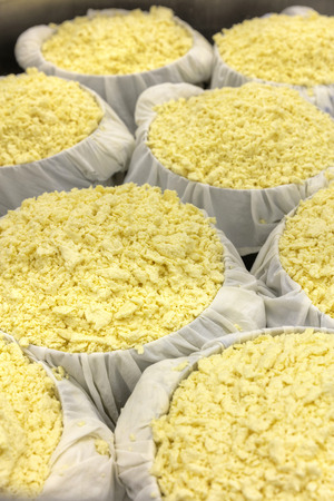 The process of making cheese separating the Curds from the Wheyの写真素材