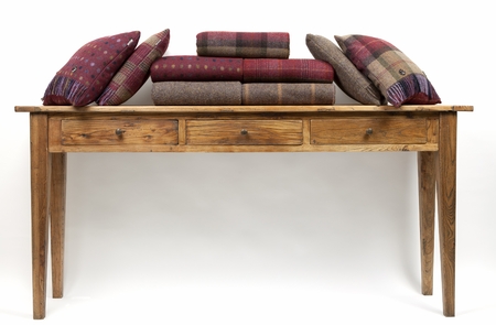 Sideboard style table with cushions on a white backgroundの写真素材