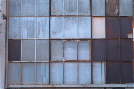 Glass window, glass wallpaper of old building, rust and covered whiteの写真素材