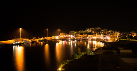 Agios Nikolaos port at nightの写真素材