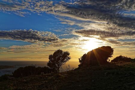 Sunset on the red island semaphoreの写真素材